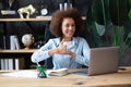 Young deaf african-american businesswoman have digital virtual online conference with employees on computer, talking on video call Royalty Free Stock Photo