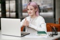 Young deaf businesswoman have digital virtual online conference with employees on computer, talking on video call Royalty Free Stock Photo