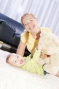 Young decorative mom plays with her son. Royalty Free Stock Photo