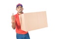 Young delivery man holding carton box and showing finger in uniform Royalty Free Stock Photo