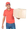 Young delivery man holding carton box in uniform Royalty Free Stock Photo