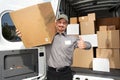 Young delivery man with a parcel.