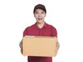 Young deliveryman holding a carton of goods