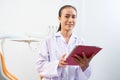 Young dentist with digital tablet