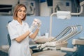 Young dentist woman in dental office