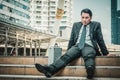 Young depressed businessman sitting on the stairs Royalty Free Stock Photo