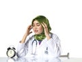 Young depressed hijab woman healthcare practitioner holding face in despair