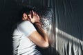 Young depressed man crying in bed Royalty Free Stock Photo