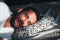 Young depressed man crying in bed Royalty Free Stock Photo