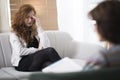 Young depressed woman in psychotherapy Royalty Free Stock Photo