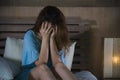 Young desperate and depressed woman crying in bed at night having depression problem and anxiety crisis feeling sad as girl Royalty Free Stock Photo