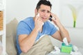 Young desperate man lying on bed alone sad Royalty Free Stock Photo