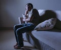 Young desperate sad and frustrated man grieving at home sofa couch suffering depression problem and anxiety crisis crying helpless Royalty Free Stock Photo