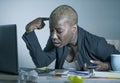 Young desperate and stressed african american business woman working at laptop computer desk at office suffering stress feeling sa Royalty Free Stock Photo