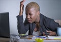 Young desperate and stressed african american business woman working at laptop computer desk at office suffering stress problem us Royalty Free Stock Photo