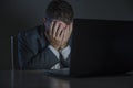 Young desperate and stressed businessman working overtime at office laptop computer desk feeling anxious and overwhelmed suffering Royalty Free Stock Photo