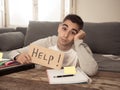 Young desperate student in stress working and studying holding a help sign Royalty Free Stock Photo