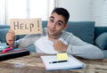 Young desperate student in stress working and studying holding a help sign Royalty Free Stock Photo