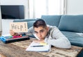 Young desperate student in stress working and studying holding a help sign Royalty Free Stock Photo