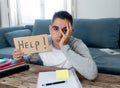 Young desperate student in stress working and studying holding a help sign Royalty Free Stock Photo