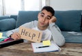 Young desperate student in stress working and studying holding a help sign Royalty Free Stock Photo