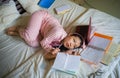 Young desperate and tired Asian Korean university student girl feeling overwhelmed and stressed preparing exam studying with Royalty Free Stock Photo