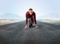 Businessman kneeling in ready position Royalty Free Stock Photo