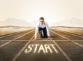 Businessman kneeling in ready position Royalty Free Stock Photo