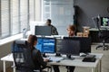 Young IT Developers Working with Multiple Computers Royalty Free Stock Photo