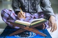 Young devout man reading Quran Royalty Free Stock Photo