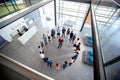 Young director hold meeting with his team in circle in company hall