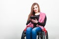 Young disabled lady with tablet. Royalty Free Stock Photo