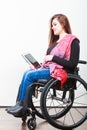 Young disabled lady with tablet.