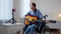 A young disabled lady is teaching how playing the guitar Royalty Free Stock Photo