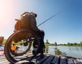 Young disabled man in a wheelchair fishing. Royalty Free Stock Photo