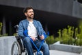 Young disabled man on a wheelchair Royalty Free Stock Photo