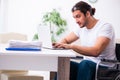 Young disabled man working from house Royalty Free Stock Photo