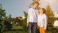 Young disabled woman and man hold hands smiling at sunset Royalty Free Stock Photo