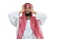 Young disappointed Arab with a checkered veiland holding his head