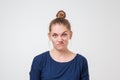 Young discontent europeam woman is discontent and is frowning her face with disgust. Royalty Free Stock Photo