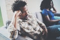 Young displeased black couple.Upset man being ignored by partner at home in the living room.American african men arguing Royalty Free Stock Photo