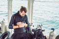 Young diver preparing an underwater compass for diving Royalty Free Stock Photo