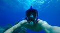 young diver in an underwater mask