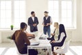 Young diverse business team having discussion during corporate meeting in office Royalty Free Stock Photo