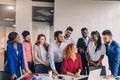 Young diverse colleague respecting their female boss