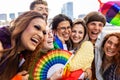 Young diverse people celebrating gay pride festival outdoors. Royalty Free Stock Photo