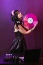 Dj headphone equipment disco girl party retro vintage ultraviolet mixer young woman vinyl glamor valentine`s day plastic pink Royalty Free Stock Photo