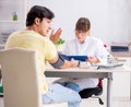 Young doctor checking patients blood pressure Royalty Free Stock Photo