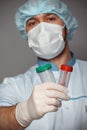 Young doctor with container for analysis Royalty Free Stock Photo