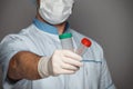 Young doctor with container for analysis Royalty Free Stock Photo